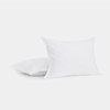 Two white square pillows are shown on a plain white background. One pillow stands upright while the other lies flat behind it. Both have clean, crisp edges and a smooth texture.