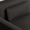 Close-up view of a modern dark grey fabric sofa with a rectangular backrest cushion, showing the texture of the upholstery and the clean, minimalist lines of the furniture.