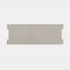 A rectangular piece of light gray, textured material with symmetrical notches on both short sides, centered on a plain white background.
