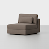 A modern, armless lounge chair with a brown upholstered fabric, featuring a rectangular back cushion and an additional lumbar pillow, set on a minimalist, light gray background.