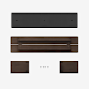 Top-down view of disassembled wooden furniture parts, including a long dark brown tabletop, two short side panels, a black panel, and five screws, all arranged neatly on a white background.