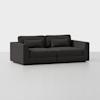A modern dark gray sofa with wide armrests, two seat cushions, and two back cushions sits on a plain light-colored floor against a white background.