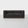 A modern, dark gray two-seater sofa with squared arms and wooden base, set against a plain white background.