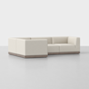 A modern L-shaped sectional sofa with light beige upholstery and a low-profile wooden base, set against a plain white background.