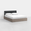 A modern bed with a light wooden frame, low platform base, black upholstered headboard, and white bedding with two pillows, set against a plain white background.