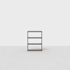 A minimalist, three-tiered dark wood shelf stands alone on a light gray floor against a plain white background. The design is simple and modern, with clean lines and no visible decorations.