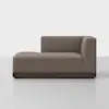 A modern brown upholstered chaise lounge with a low backrest and armrest on the right side, set on a dark wooden base, positioned against a plain white background.