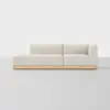 A modern, light beige sectional sofa with a wooden base sits on a smooth, light gray floor against a plain white background. The sofa has clean lines and a minimalist design.