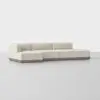 A modern beige sectional sofa with clean lines, low backrests, and a wooden base, set against a plain light gray background.
