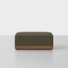A rectangular, textured brown ottoman sits on a wooden base against a plain white background.