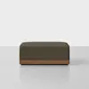 A rectangular, textured brown ottoman sits on a wooden base against a plain white background.