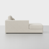 A modern, light beige sectional sofa with clean lines, shown in a side profile view against a plain white background. The sofa has plush cushions and a chaise lounge extension on the right side.