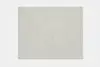 A rectangular, light beige area rug with a soft, solid color and subtle texture, displayed on a white background.