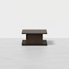 A modern, rectangular dark wood coffee table with a wide top and bottom base, connected by a central column, set against a plain white background.
