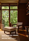 A modern living space with a large window showing green trees, featuring a walnut and ivory lounge chair with matching ottoman and a walnut side table. Text describes the furniture models and materials.