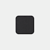 A dark gray, square-shaped object with rounded corners is centered on a light gray background.