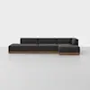 A modern, dark gray sectional sofa with clean lines and a wooden base, set against a plain white background on a light-colored floor.