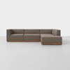 A modern, L-shaped sectional sofa with brown fabric upholstery and a low wooden base, set against a plain white background.