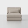 A modern, armless beige upholstered chair with a rectangular back cushion and a matching lumbar pillow, placed on a light gray floor against a plain white background.