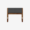 A minimalist wooden chair with straight legs and a rectangular, upholstered dark gray backrest and seat cushion, photographed against a plain white background.
