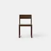 A simple, modern wooden chair with a square seat, straight legs, and a rectangular backrest, photographed against a plain white background.