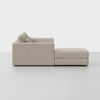 A modern beige sectional sofa with clean lines and plush cushions, viewed from the side against a plain, light-colored background.