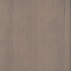 A close-up of a wooden surface showing a natural light brown color with visible grain lines and subtle texture variations.