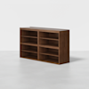 A modern, wooden bookshelf with a rich brown finish, featuring two sections side by side, each with four open shelves, placed on a light gray floor against a plain white background.