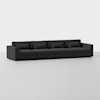A modern, dark gray, four-seater sectional sofa with clean lines, square arms, and matching back and seat cushions is shown against a plain white background.