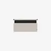 A rectangular beige wall organizer with a black horizontal stripe at the top, mounted on a white background. The organizer has a fabric texture and a small tag on the bottom right corner.