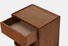 A wooden nightstand with a single open drawer, viewed from above at an angle. The nightstand has a smooth finish and simple, modern design with rounded edges.