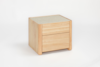A modern, light wood nightstand with clean lines, featuring two drawers and a smooth, rectangular design, shown against a plain white background.
