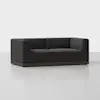 A modern, dark gray upholstered loveseat with a boxy design and low wooden base, set against a plain white background.