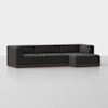 A modern, dark gray sectional sofa with clean lines and a low wooden base sits on a light gray floor against a plain white background.