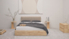 A minimalist bedroom with a light wood bed frame, beige headboard, gray bedding, two matching wooden nightstands, a small branch in a vase, modern art above the bed, and a wooden dresser on the right.