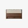 A minimalist wooden headboard with a light beige upholstered cushion panel on top, set against a plain white background.