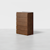 A tall, modern wooden dresser with five drawers, featuring a smooth, minimalist design and no visible handles, set against a plain white background.
