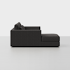 A modern dark gray sectional sofa with clean lines and thick cushions, shown in a side profile against a plain white background.