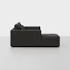 A modern dark gray sectional sofa with clean lines and thick cushions, shown in a side profile against a plain white background.