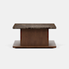 Rectangular coffee table with a dark marble top, a wide center wooden pedestal, and a flat wooden base, set against a plain white background.