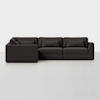 A modern, dark gray L-shaped sectional sofa with three seat cushions, three back cushions, and three matching rectangular pillows, shown against a plain white background.