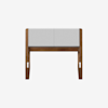 A modern wooden bench with angled legs and a light gray cushioned seat, shown against a plain white background.