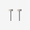 Two identical metal screws with knurled cylindrical heads and long threaded shafts, standing upright on a plain white background, side by side.