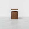 A wooden storage box with a detached lid hovering above it, set against a plain white background.