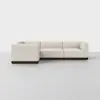 A modern, L-shaped sectional sofa with cream-colored upholstery and a dark wooden base, set against a plain white background on a light gray floor.