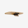 A modern, rectangular wooden shelf with rounded edges and three black and cork brackets beneath it, mounted against a plain white background.