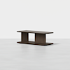 A modern, dark wood coffee table with a rectangular top, open middle shelf, and two sturdy vertical supports on either side, set against a plain white background.