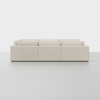A modern, minimalist beige sofa with three seat sections, viewed from the back against a plain white background. The sofa has clean lines and a boxy shape.