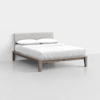 A minimalist wooden bed frame with a light gray upholstered headboard, neatly made with white bedding and two pillows, set against a plain white background.