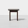 A small, dark brown wooden table with a simple, minimalist design, featuring straight legs and a rectangular top, set against a plain white background.